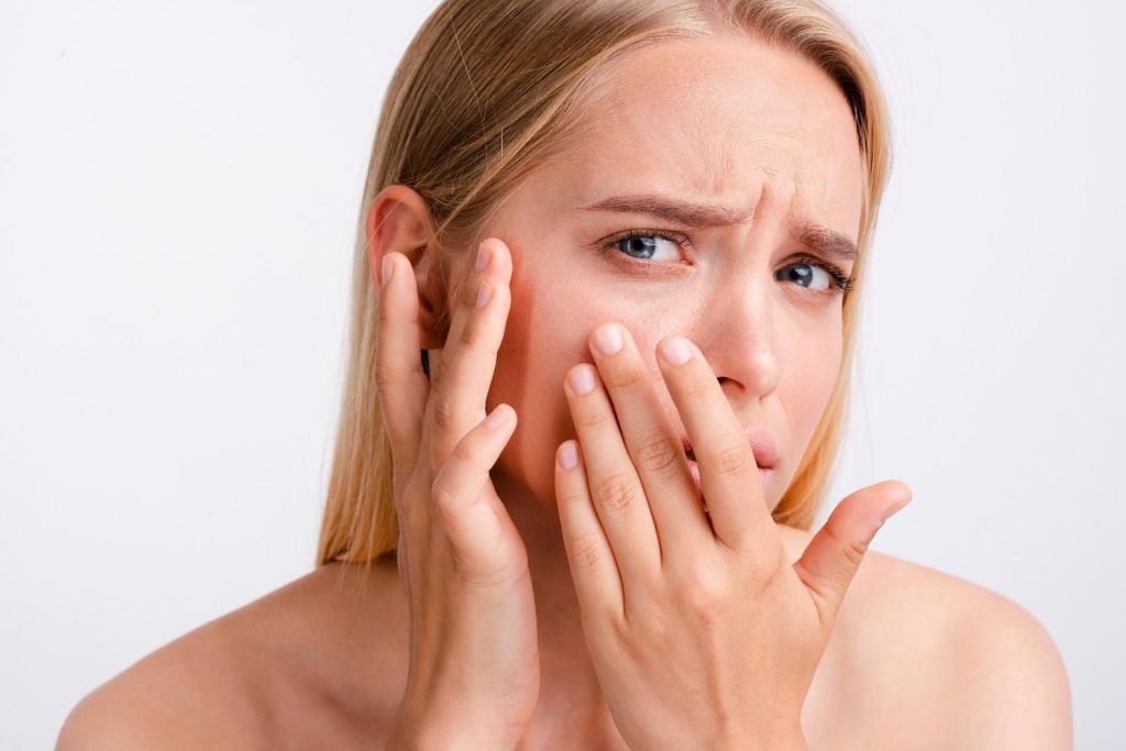 profhilo bumps not going down - woman looking closely at her bumps