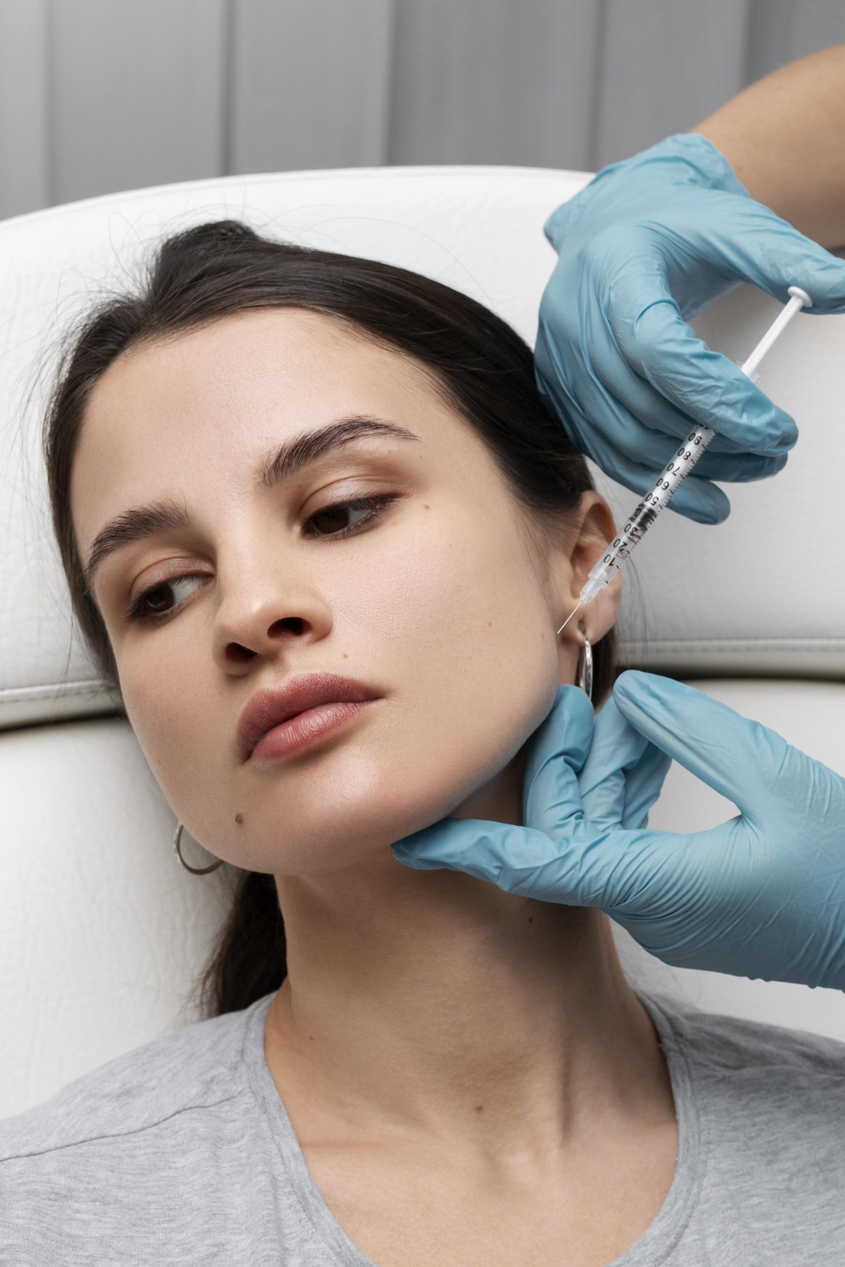 young female patient receiving diluted Radiesse treatment