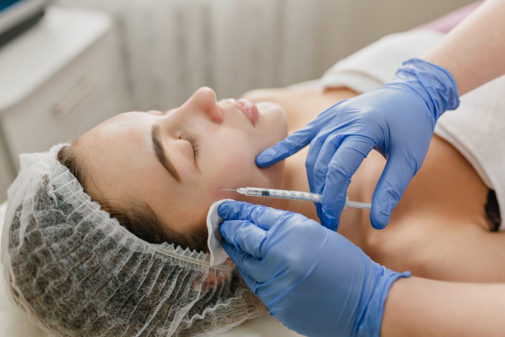 Female patient receiving Radiesse injection