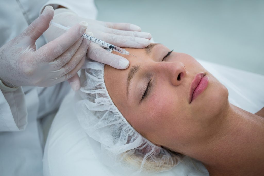 female patient receiving radiesse filler